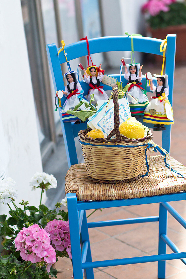 Chair with dolls and lemons in Capri Town in Capri, Italy