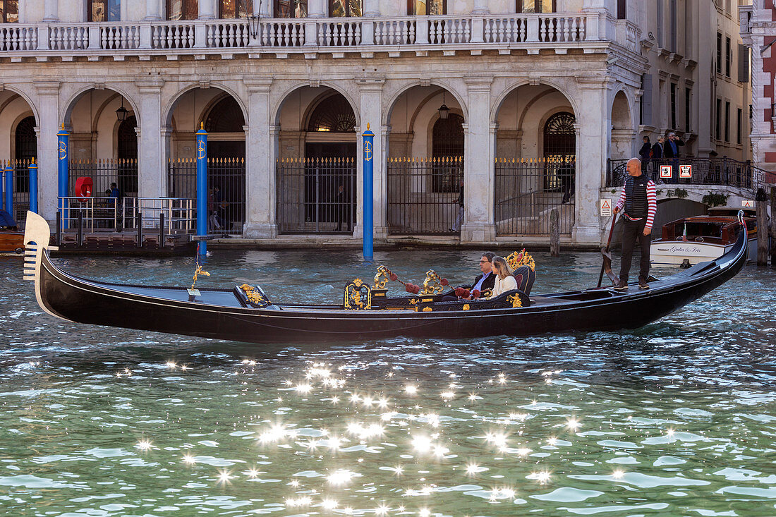 Godel with guests in the Grand Canal in Venice, Veneto, Italy