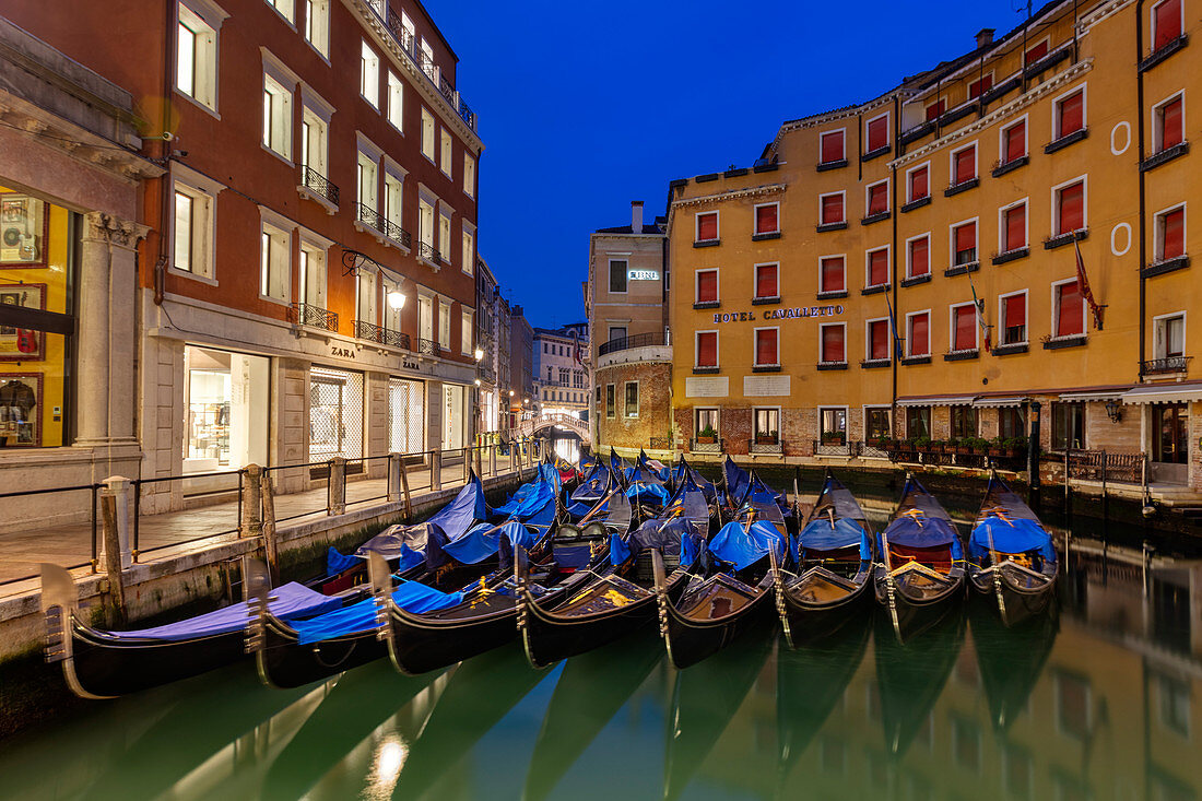 Resting gondolas at Bacino Orseolo in Venice before sunrise, Veneto, Italy