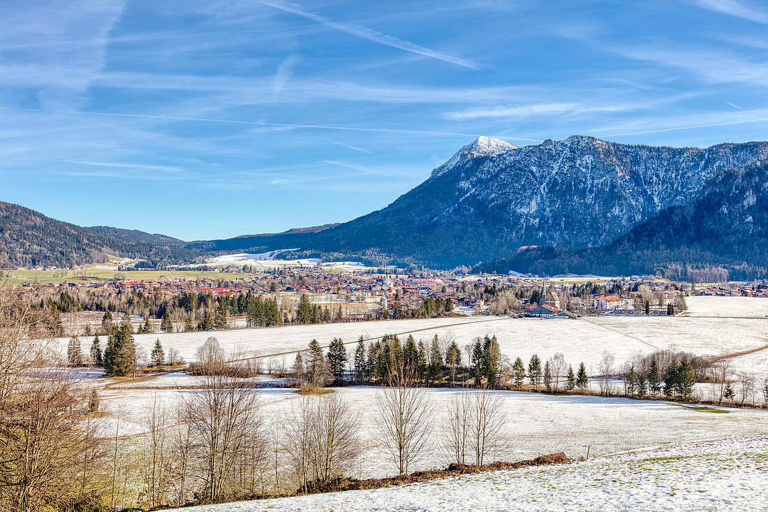 Inzell in winter in the midday sun with snow, Bavaria, Germany