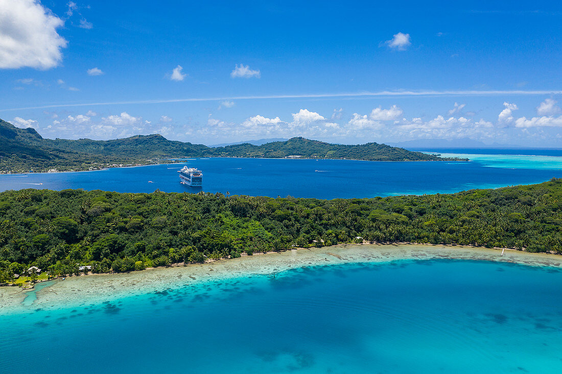 Aerial view of cruise ship in roadstead in Bora Bora lagoon, Bora Bora, Leeward Islands, French Polynesia, South Pacific