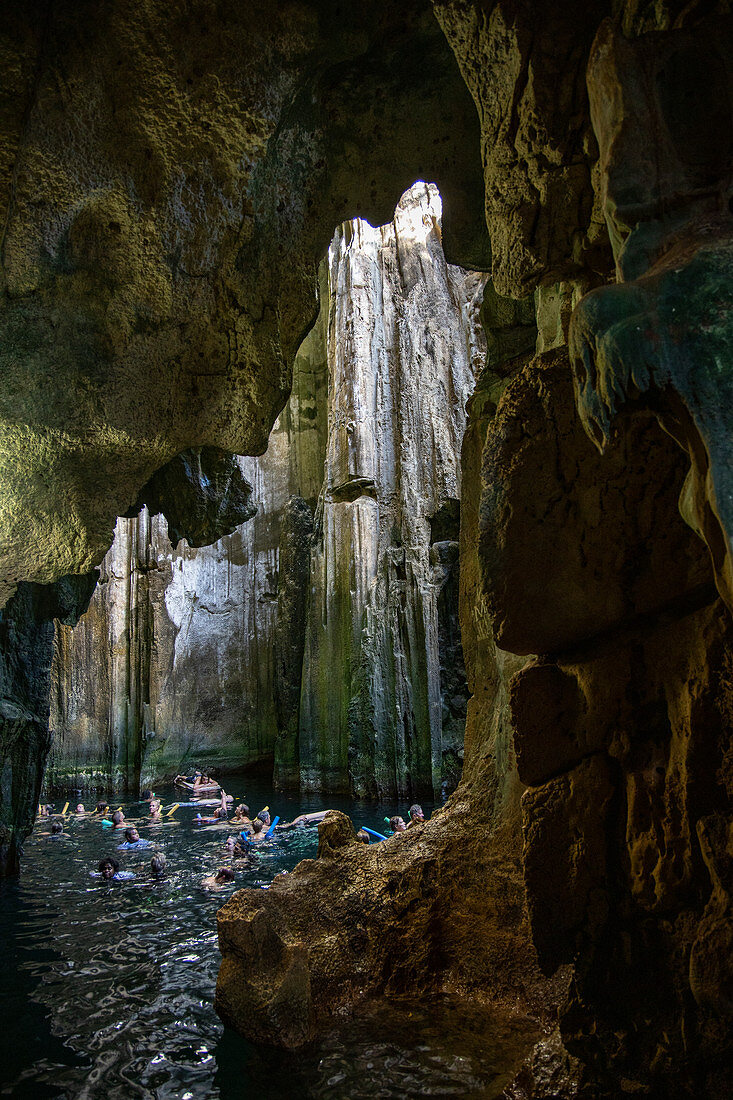 Passengers of the cruise ship MV Reef Endeavor (Captain Cook Cruises Fiji) swim and bathe in the cave of Sawa-i-Lau, Sawa-i-Lau Island, Yasawa Group, Fiji Islands, South Pacific