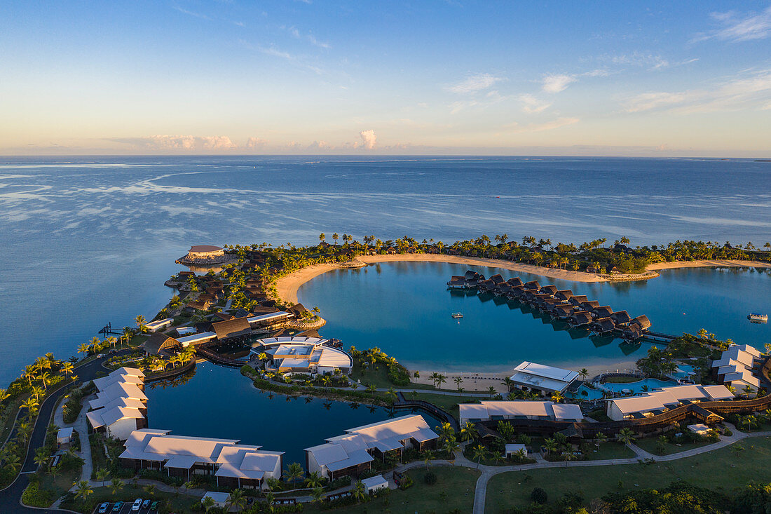 Aerial view of overwater bungalows at Fiji Marriott Resort Momi Bay at sunrise, Momi Bay, Coral Coast, Viti Levu, Fiji Islands, South Pacific