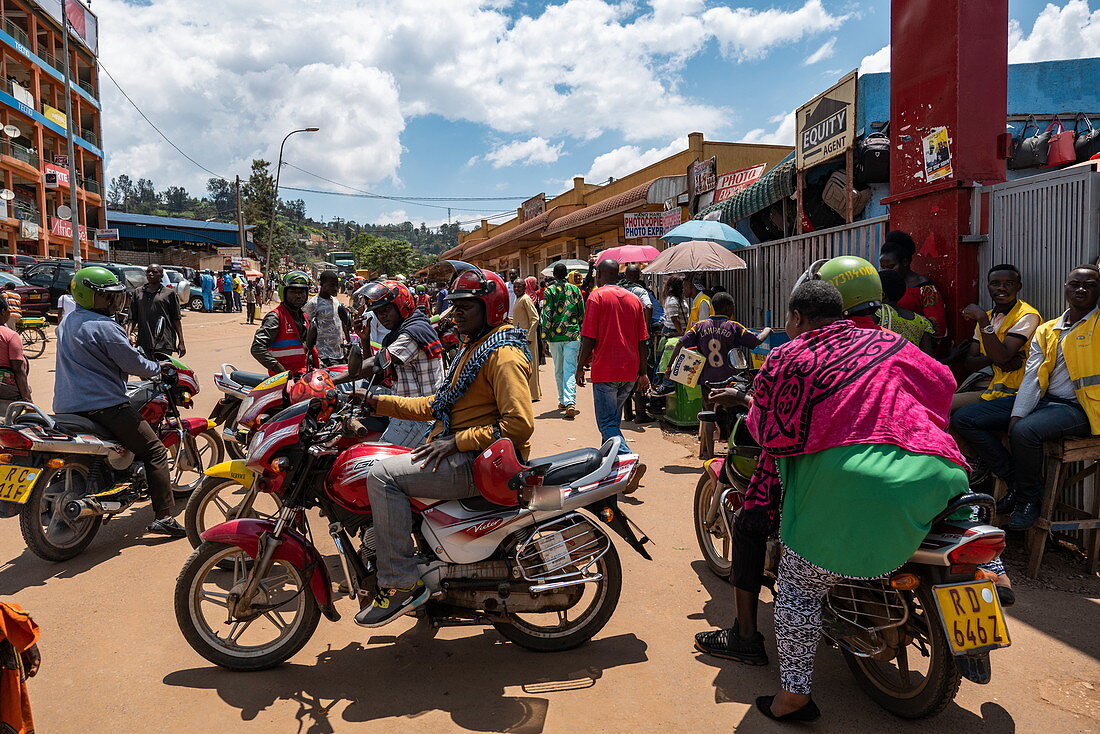 Lively scene with motorcycle taxis in front of the Kimironko Market, Kigali, Kigali Province, Rwanda, Africa