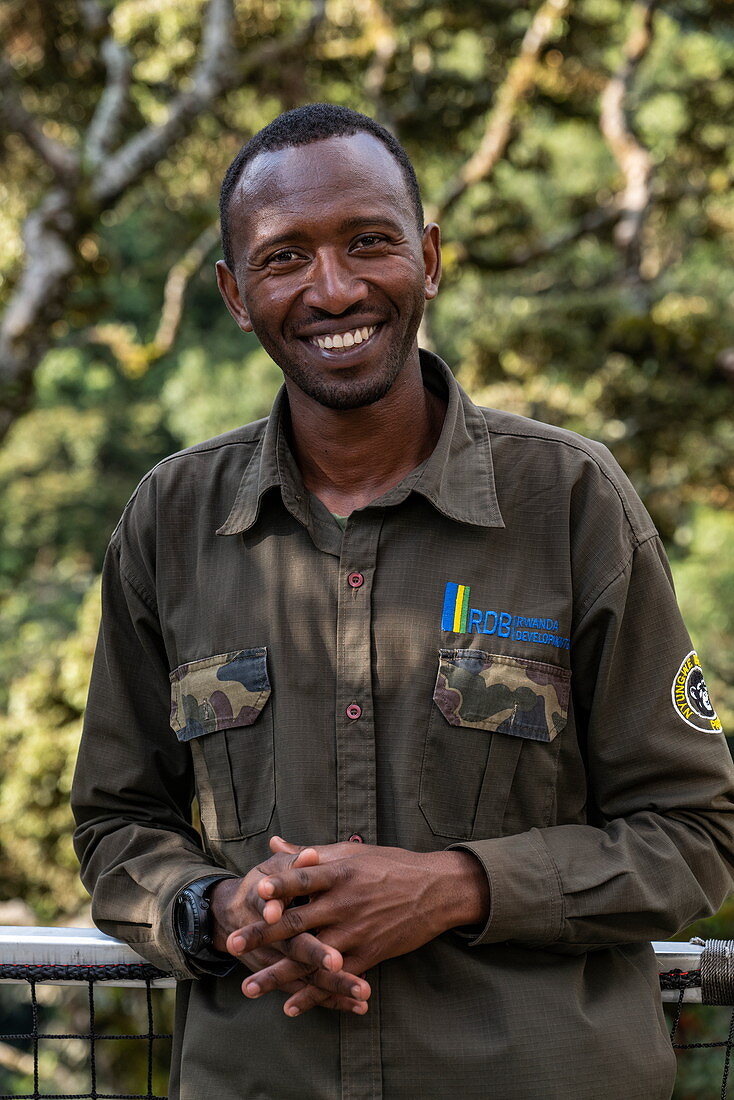 Smiling ranger guide on Canopy Walkway, Nyungwe Forest National Park, Western Province, Rwanda, Africa