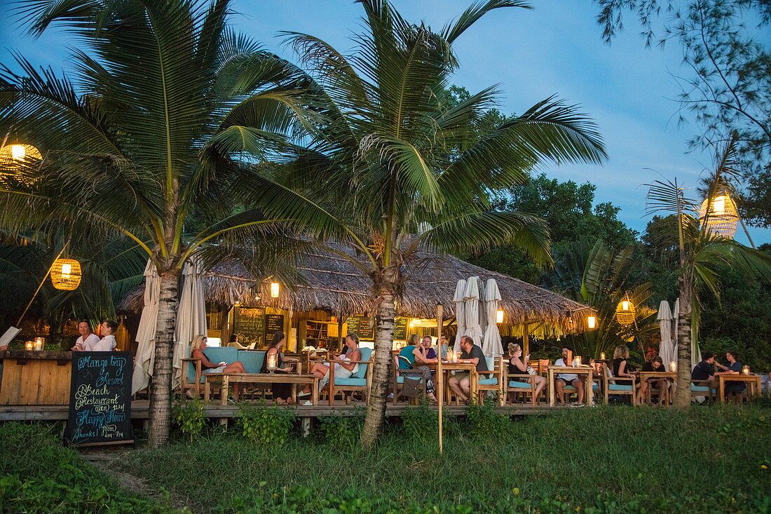 People enjoying drinks in the restaurant and bar of the Mango Bay Resort on Ong Lang Beach at dusk, Ong Lang, Phu Quoc Island, Kien Giang, Vietnam, Asia