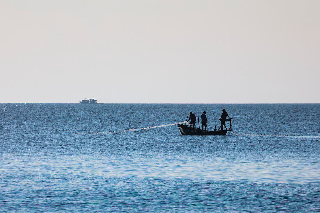Silhouette of fishermen on boat, Ong Lang, Phu Quoc Island, Kien Giang, Vietnam, Asia