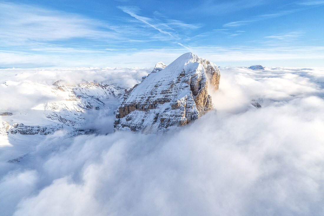 Winter aerial view of Tofana di Rozes in a sea of clouds, Dolomites, Belluno province, Veneto, Italy