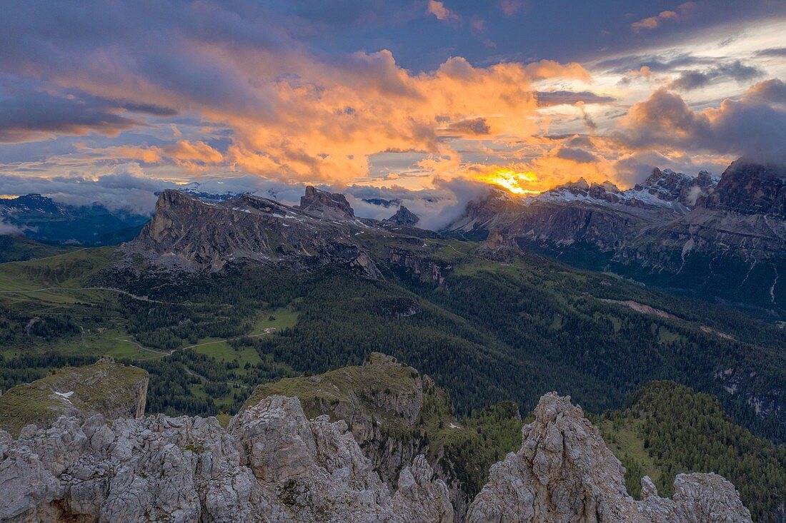 Burning sky at sunset over Giau Pass, Lagazuoi, Cinque Torri and Tofane, aerial view, Dolomites, Belluno, Veneto, Italy