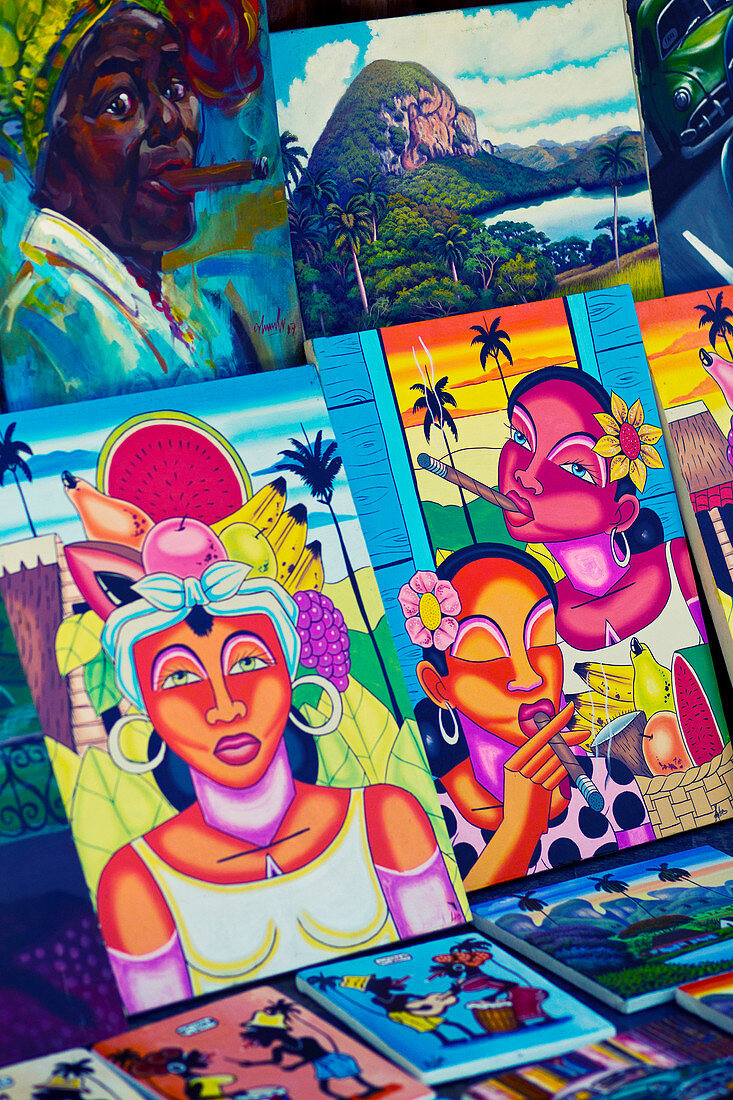 Colourful Cuban paintings on a market in Viñales