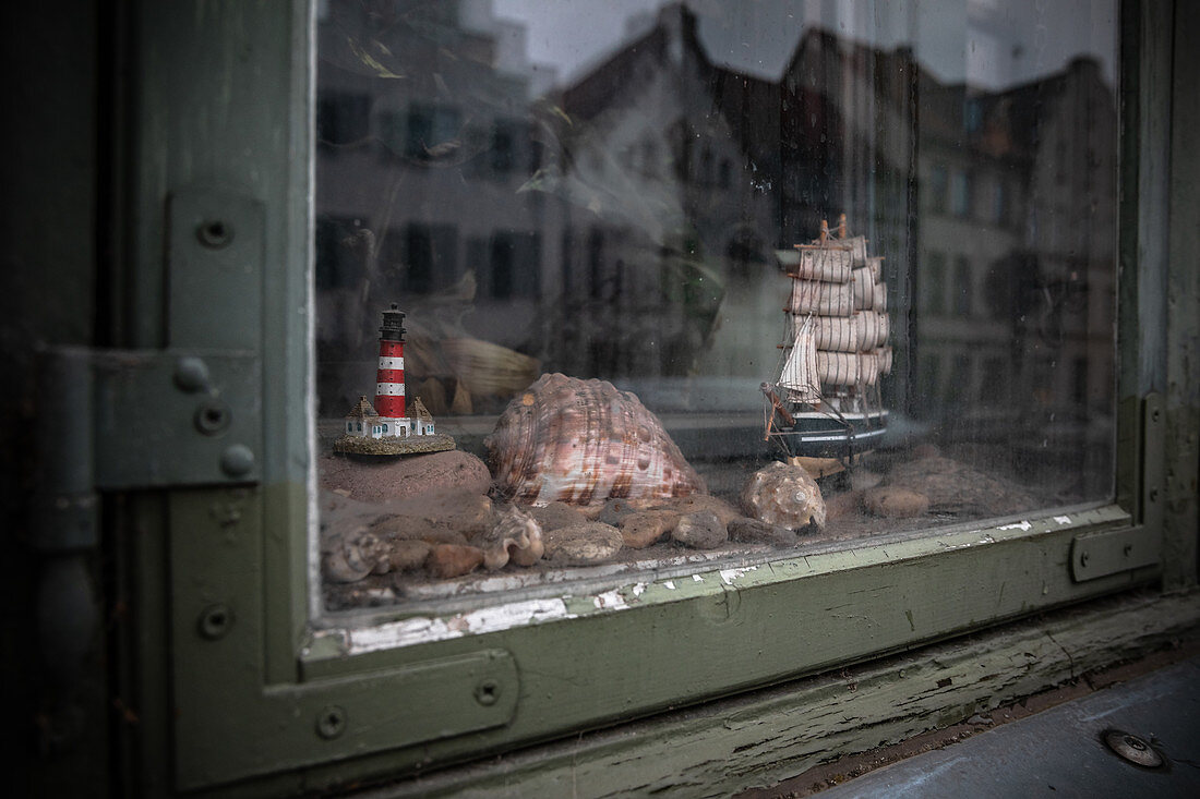 Shop window with ship and lighthouse in Wismar, Germany