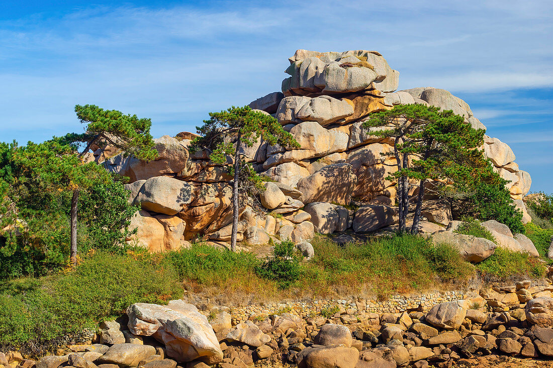 Rocky landscape on the Cote de Granit Rose in the foreground, Brittany, France, Europe