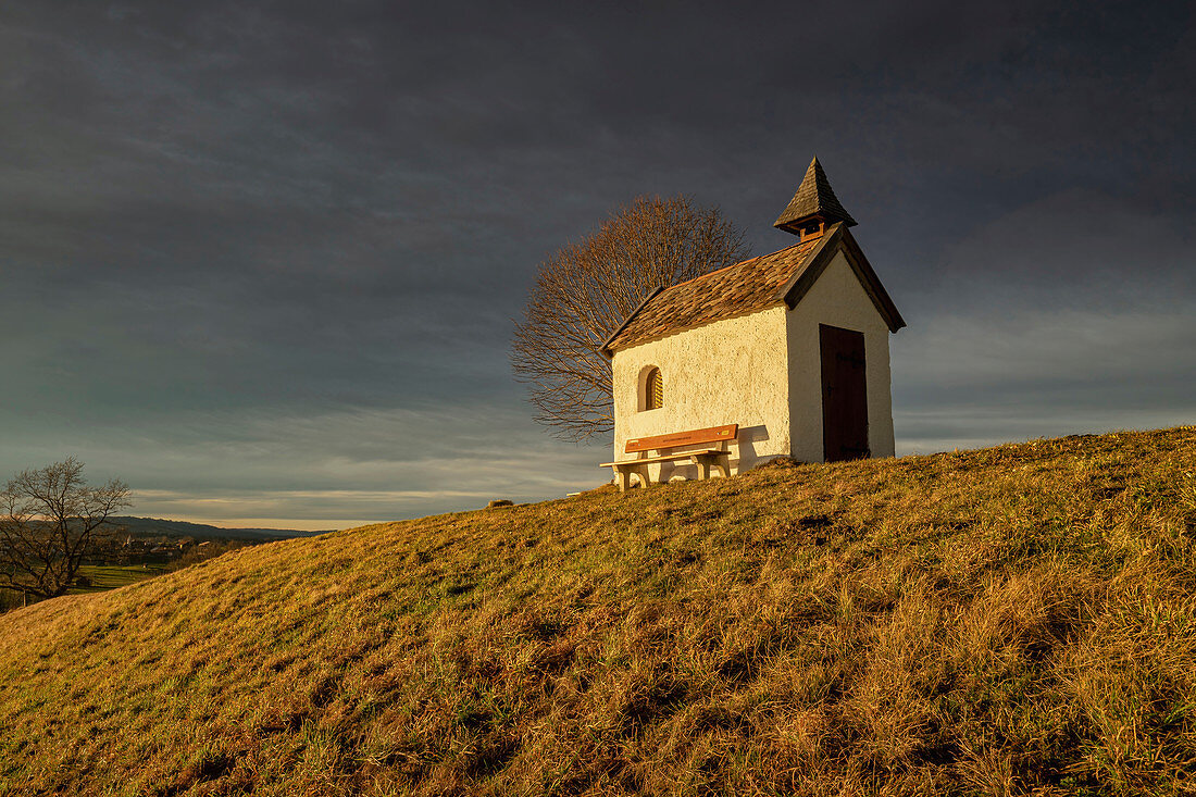 The chapel at Riegsee in the evening in early spring, Aidling, Murnau, Bavaria, Germany