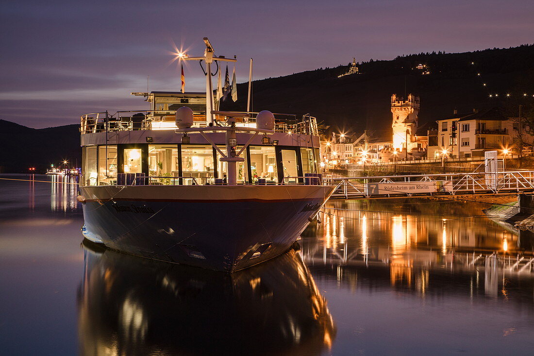 River cruise ship at the pier during a cruise on the Rhine at dusk, Ruedesheim am Rhein, Hesse, Germany, Europe