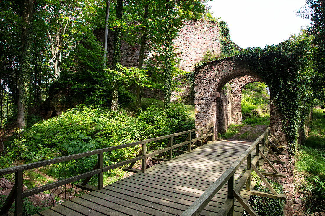 Wooden bridge over moat and stone gate of the Wildenstein castle ruins, Eschau Wildenstein, Räuberland, Spessart-Mainland, Franconia, Bavaria, Germany, Europe