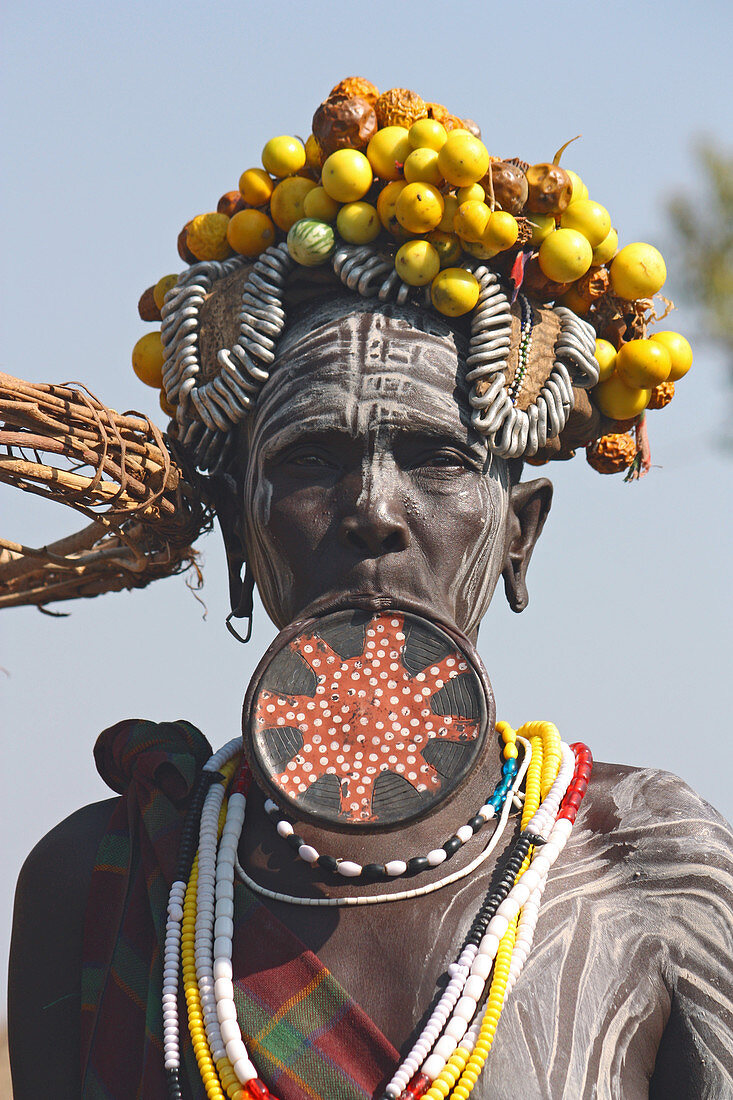 Ethiopia; Southern Nations Region; southern Ethiopian highlands; Mago National Park; lower Omo River; Mursi woman with lip plate and headdress