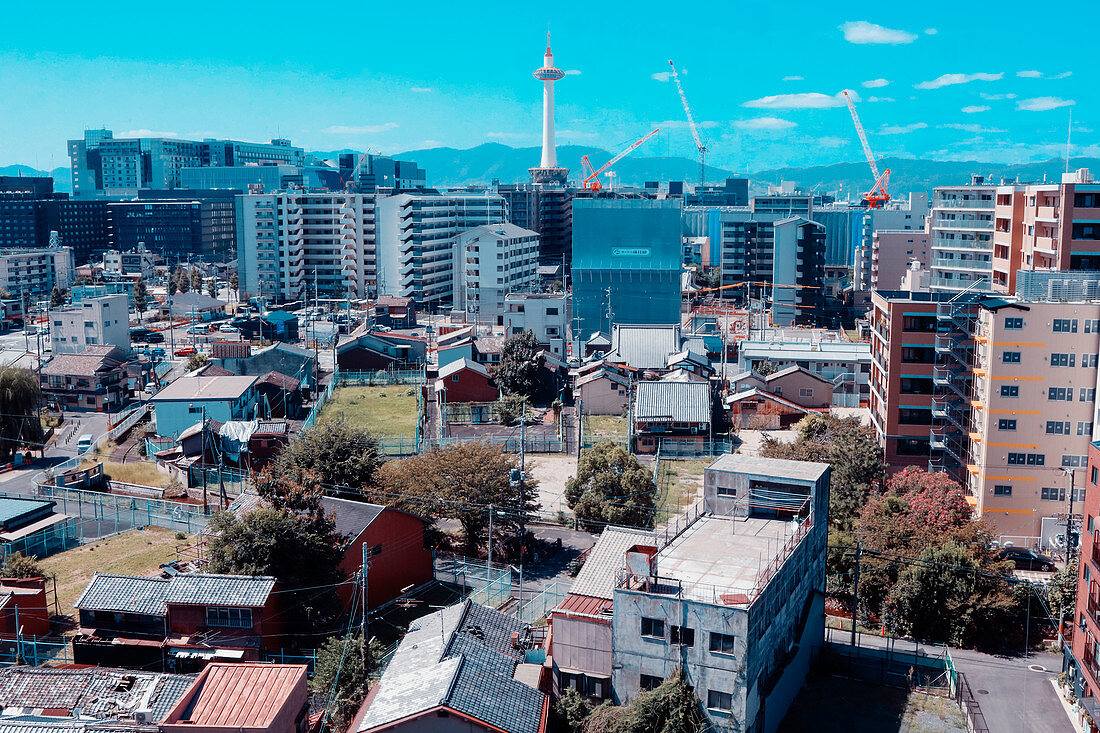 City backdrop with Kyoto Tower in the background in the midday sun, Kyoto, Japan