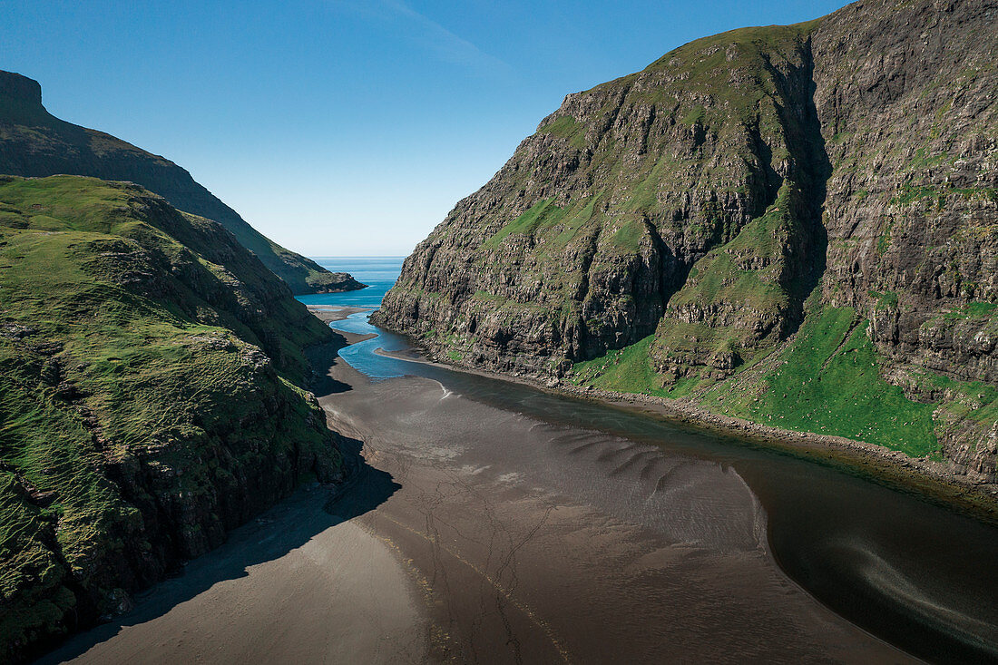 Bay with sand and water at Saksun on Streymoy Island in the Faroe Islands