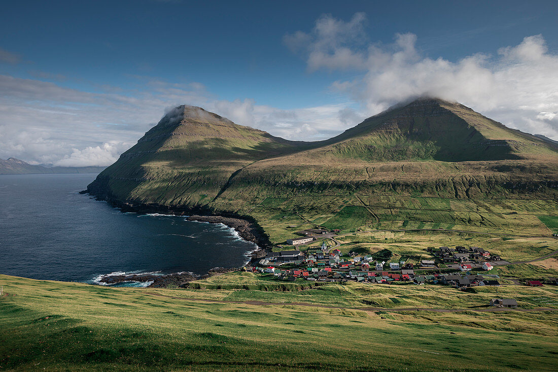 Village of Gjogv on Eysteroy with gorge, sea and mountains, Faroe Islands