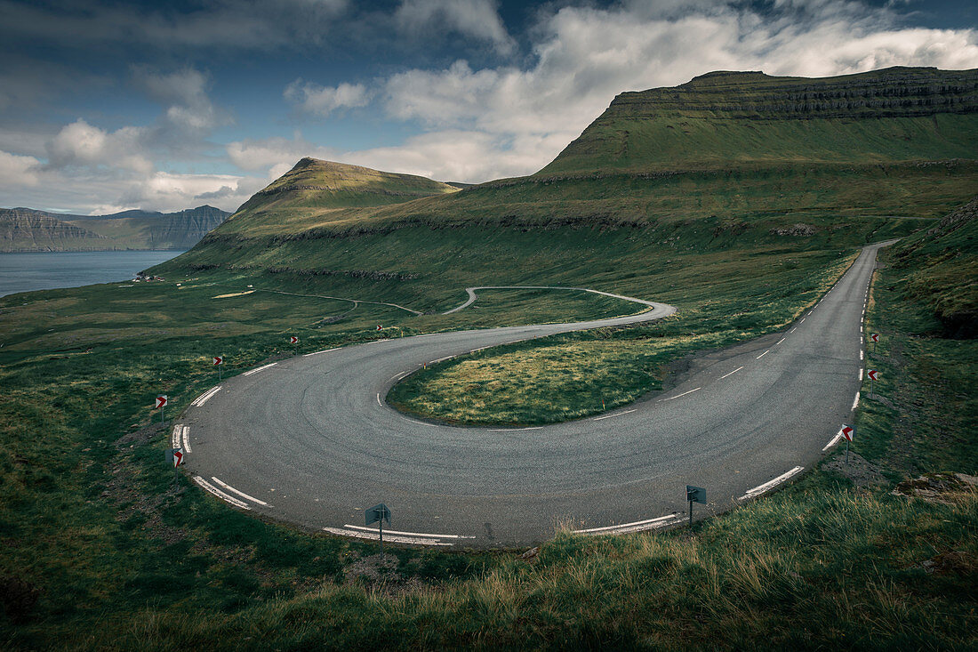 Curve of a road at Oyndarfjørður on the island of Eysteroy, Faroe Islands