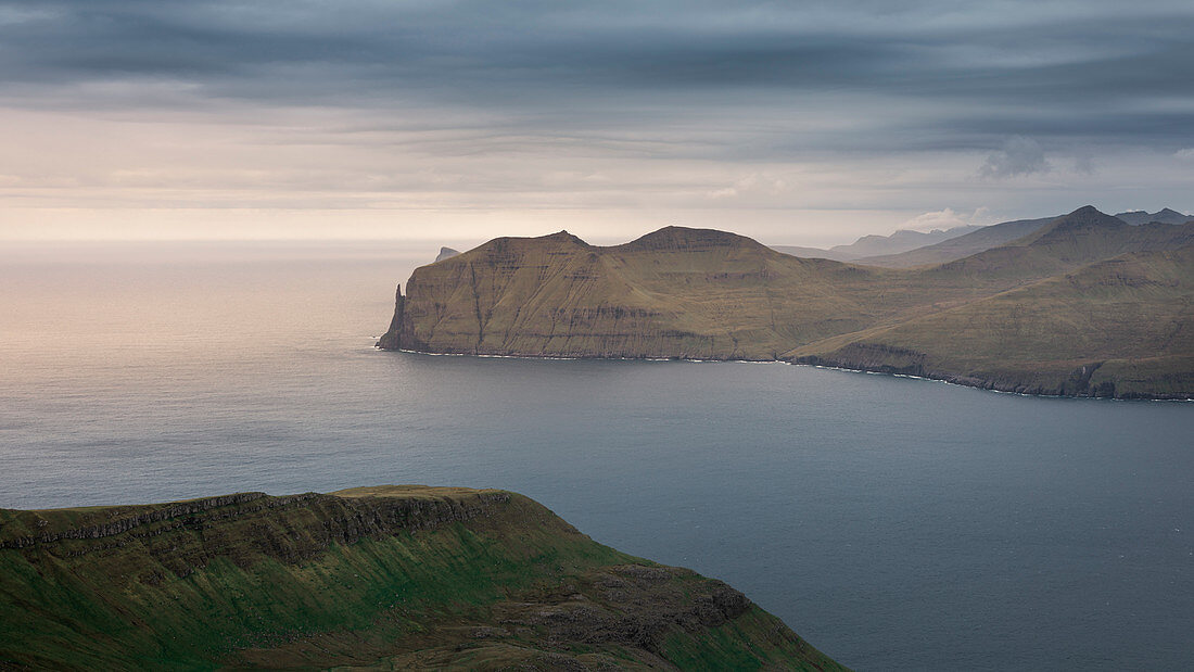 Panorama with Witchesfinger Rock of Streymoy and Vagar with clouds, Faroe Islands