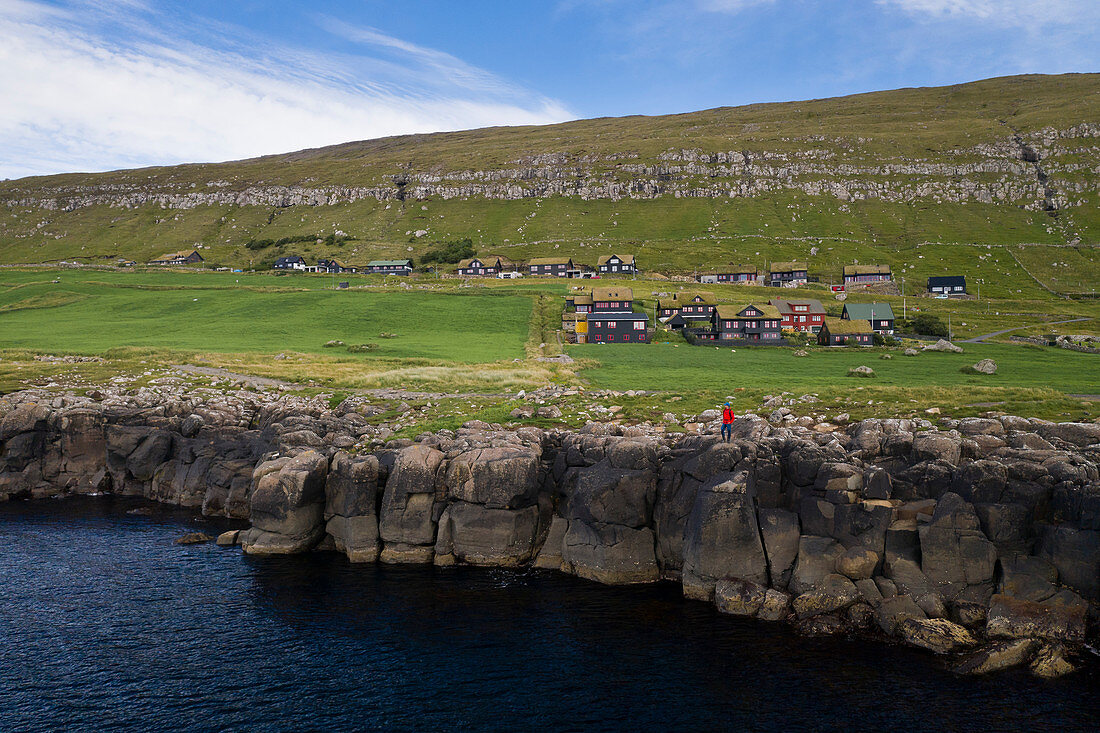 Coast at the village Kirkjubøur on Streymoy in the sun, Faroe Islands