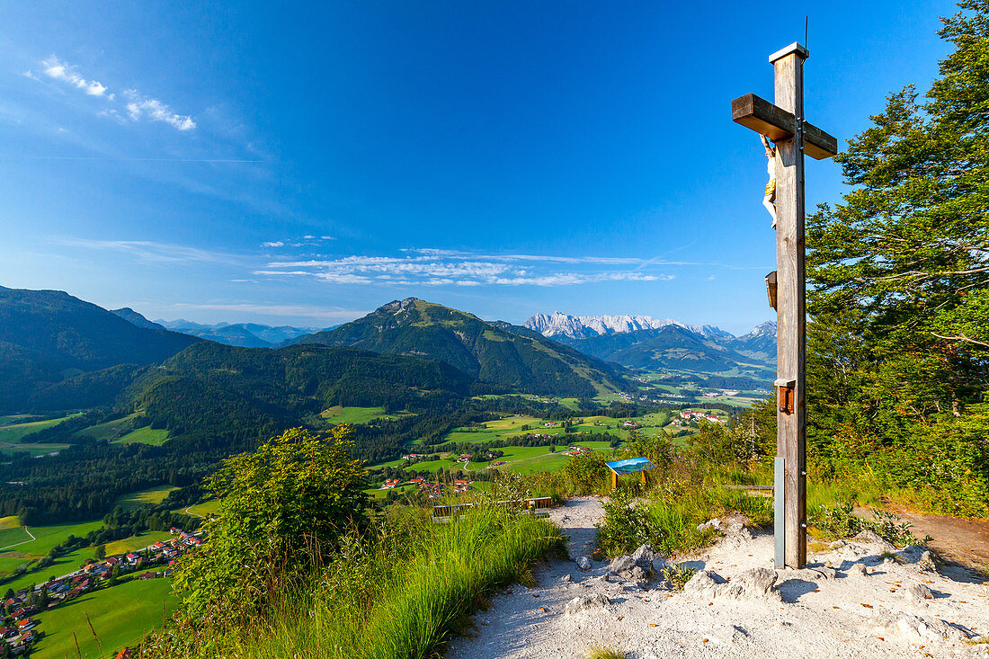Weather cross in Reit im Winkl with a view of Kaiserwinkl and Tyrolean Alps in autumn, Chiemgau, Bavaria, Germany
