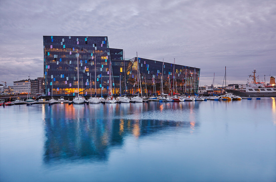 An evening view of the modern Harpa Concert Hall, beside the old harbour in Reykjavik, southwest Iceland, Polar Regions