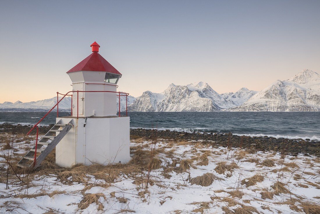 Traditional lighthouse on the coast, Spaknesora naturreservat, Djupvik, Lyngenfjord, Lyngen Alps, Tromso, Norway, Europe