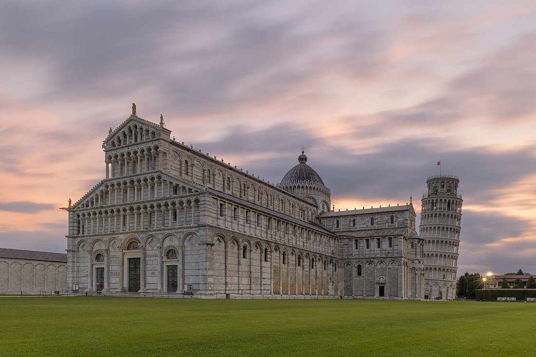 the extraordinary cathedral of Pisa with the adjacent leaning tower photographed on a coloured summer sunrise, Unesco World Heritage Site, municipality of Pisa, Pisa province, Tuscany district, Italy, Europe