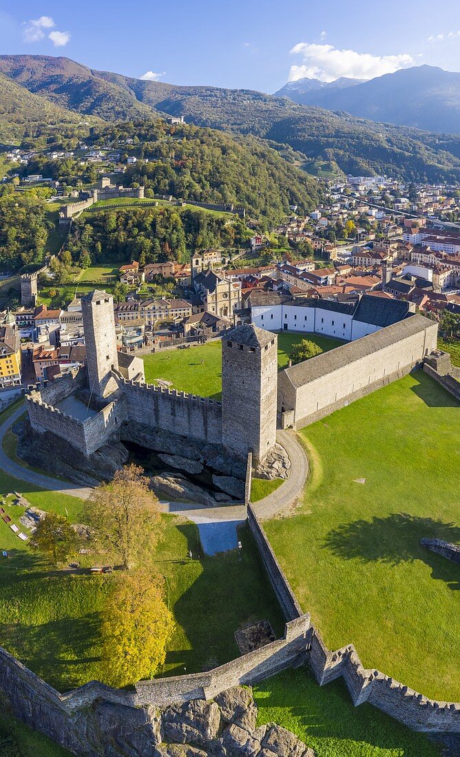 Aerial view of the medieval Bellinzona castles, Unesco World Heritage site, in autumn at sunset. Canton Ticino, Switzerland.