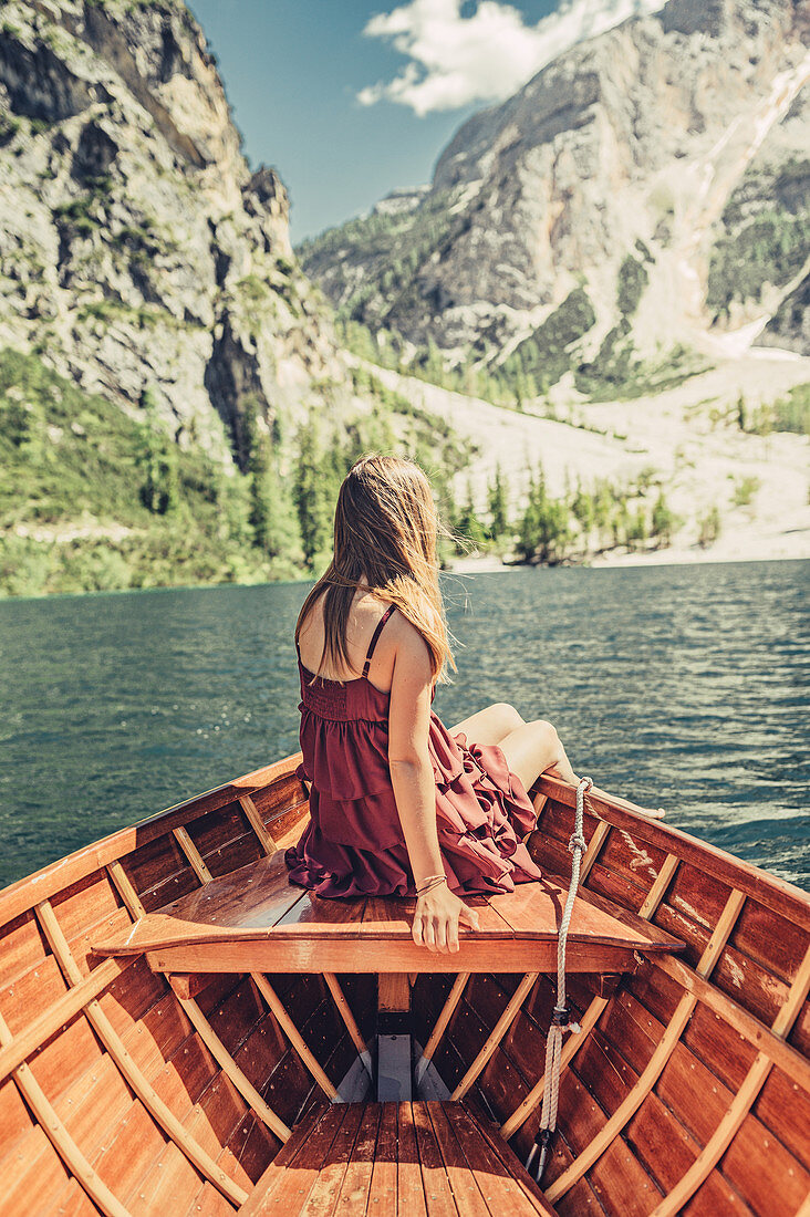 Woman on a boat trip on Lake Braies amid the Dolomites in South Tyrol, Italy, Europe
