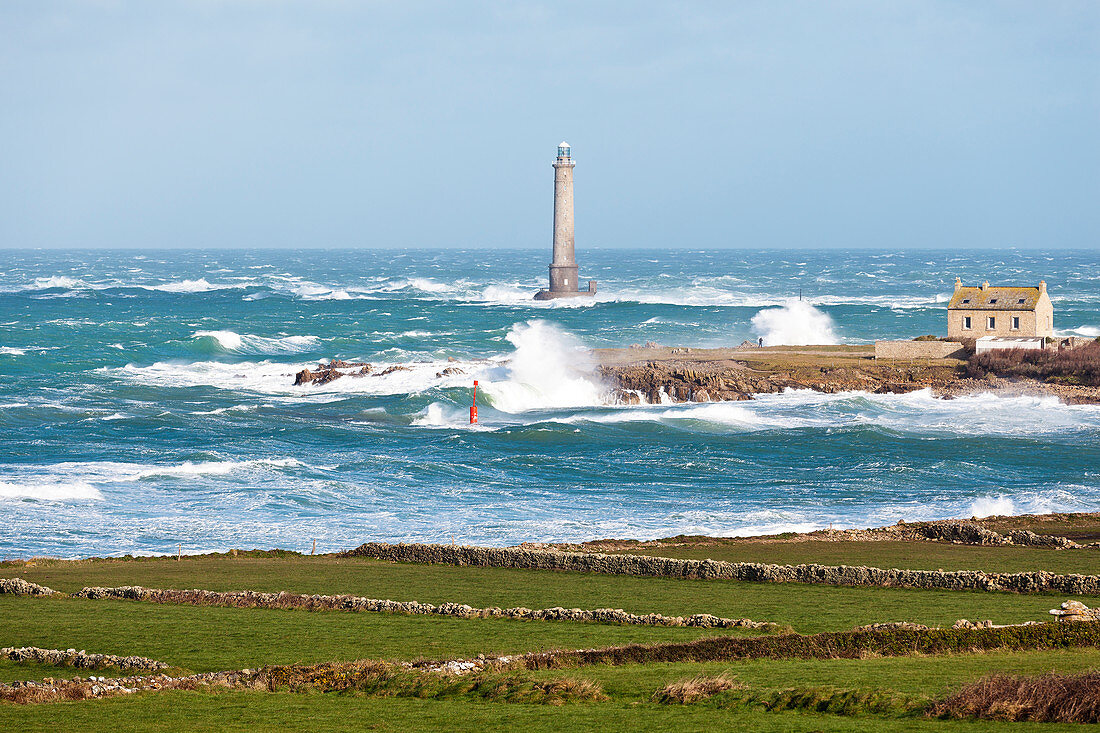 The port of Goury on the Cotentin Peninsula, Normandy, France in a storm. Old stone walls in the foreground.