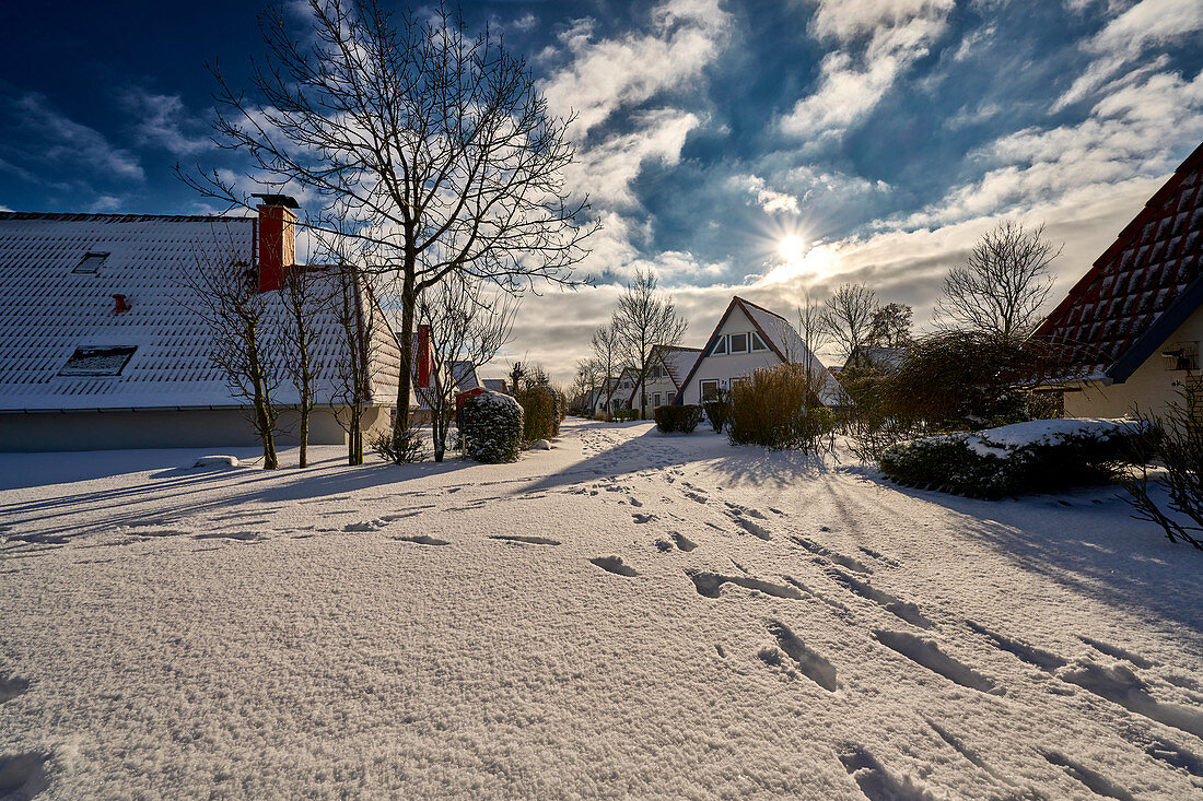 Snow-covered country houses. Dorum, Lower Saxony, Germany