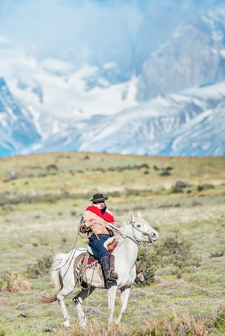 Cowboy on horseback, Torres del Paine National Park, Chile