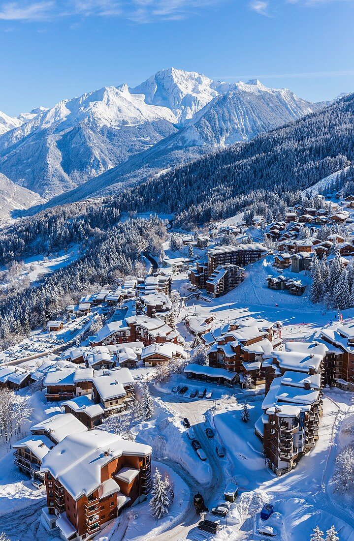 France, Savoie, Tarentaise valley, La Tania is one of the largest skiresort village in France, in the heart of Les Trois Vallees (The Three Valleys), one of the biggest ski areas in the world with 600km of marked trails, western part of the Vanoise Massif, view of the Grand Bec Peak (3398m) in Parc National de La Vanoise (aerial view)