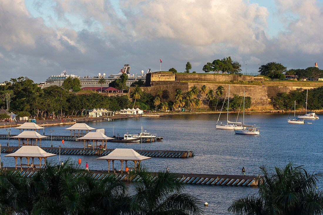 Martinique, Caribbean Sea, Bay of Fort de France, Flemish Bay at sunrise overlooking the pontoons, Fort Saint-Louis, La Savane and in the background a liner at the pier