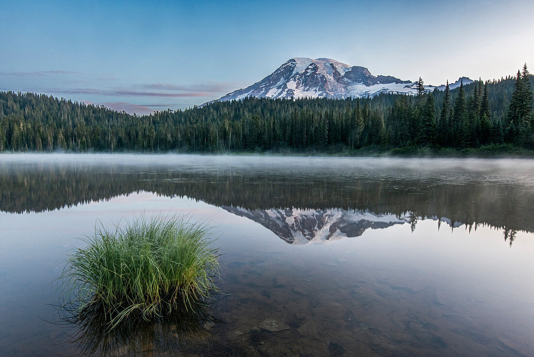 Reflection of Mount Rainier in Reflection Lake in Mount Rainier national park at dawn.