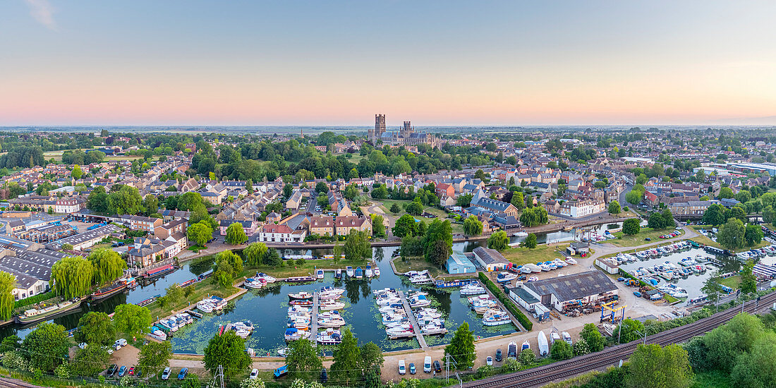 Drone view of Ely Cathedral with Ely Marina and Great Ouse River in foreground, Ely, Cambridgeshire, England, United Kingdom, Europe