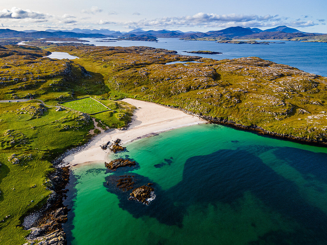 Aerial of white sand and turquoise water at Bosta Beach, Isle of Lewis, Outer Hebrides, Scotland, United Kingdom, Europe
