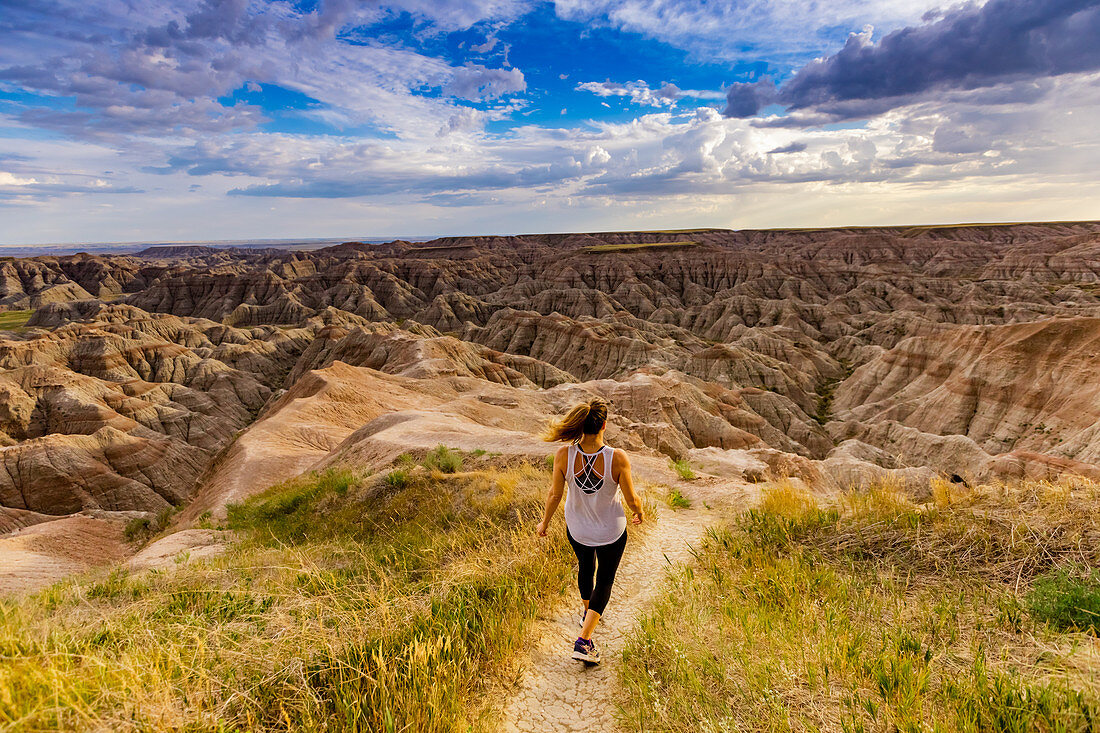 Woman hiking her way through the scenic Badlands, South Dakota, United States of America, North America
