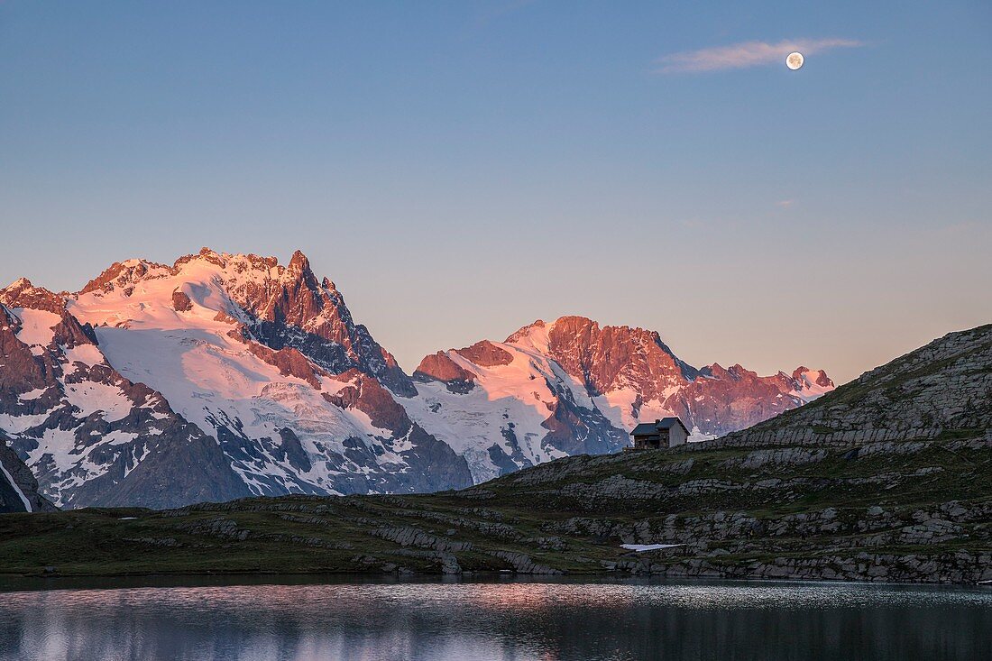 France, Hautes Alpes, Ecrins National Park, the refuge and the lake Goleon (2438m) in the massif of Oisans with La Meije and the Râteau (3809m) in the background