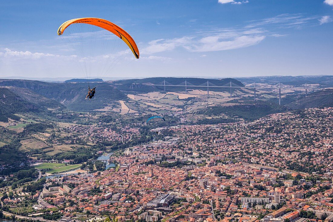 France, Aveyron, Parc Naturel Regional des Grands Causses (Natural Regional Park of Grands Causses), Millau, flight in paragliding over Millau, the viaduct in the background