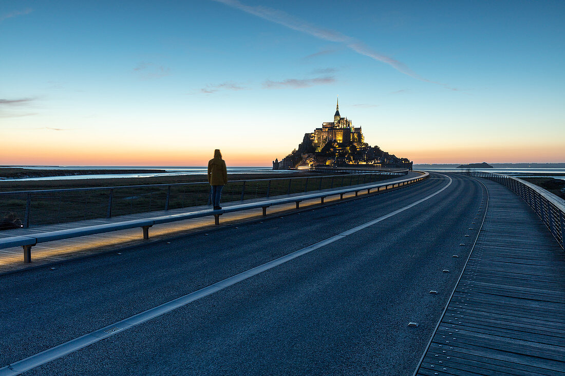 Evening view of the rocky island of Mont Saint Michel with the monastery of the same name, Normandy, France.