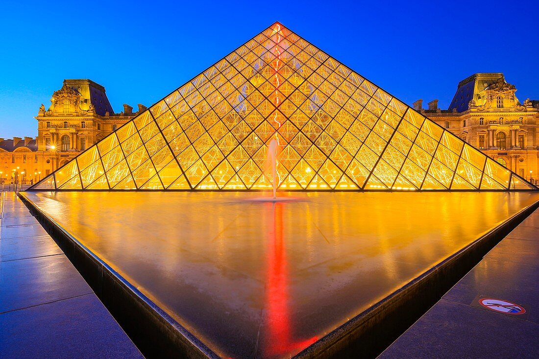 France, Paris, area listed as World Heritage by UNESCO, the Louvre Pyramid of the architect Ieoh Ming Pei and facade of the Richelieu Pavilion in the Napoleon courtyard