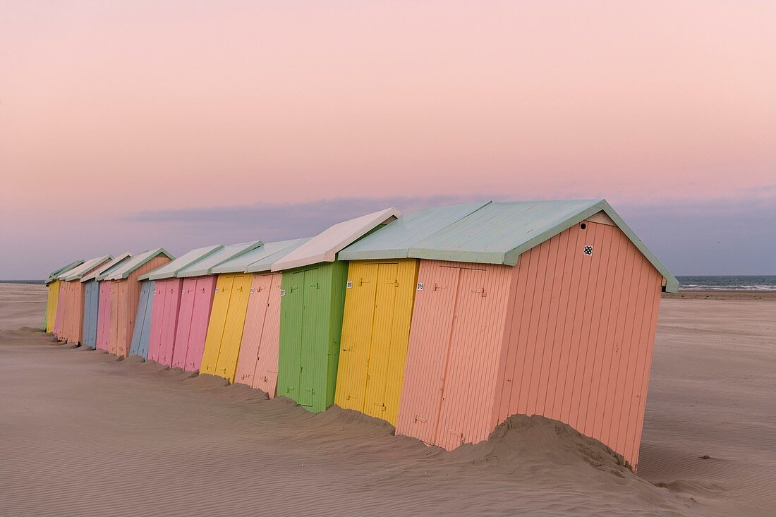 France, Pas de Calais, Berck sur Mer, beach cabins in Berck sur Mer at the end of the season, the wind has swept the beach and erosion gnaws the support of the cabins that rock and give an off season atmosphere