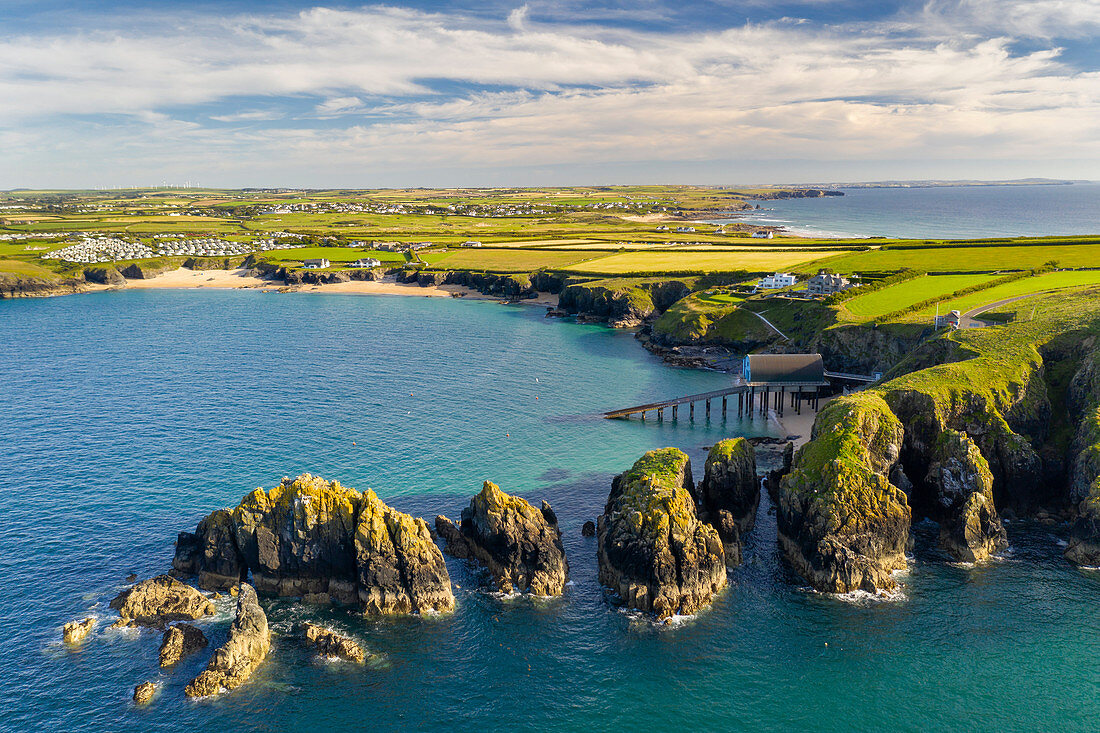 Aerial vista of Merope Rocks, Padstow Lifeboat Station and Mother Ivey's Bay, Cornwall, England, United Kingdom, Europe