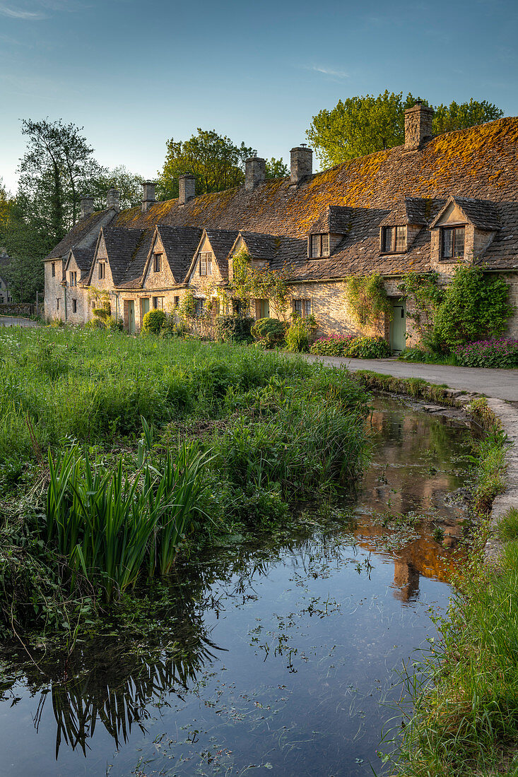Early Spring morning view of the beautiful Cotswolds cottages at Arlington Row in Bibury, Gloucestershire, England, United Kingdom, Europe