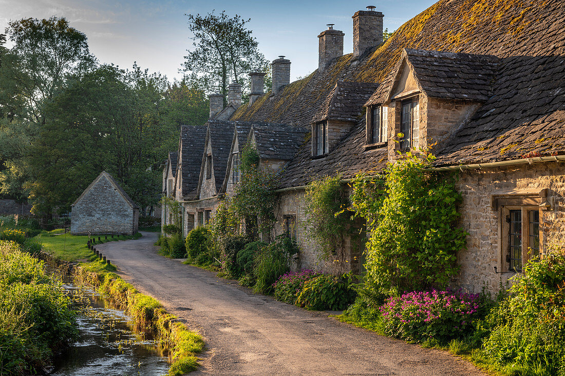 Early Spring morning view of the beautiful Cotswolds cottages at Arlington Row in Bibury, Gloucestershire, England, United Kingdom, Europe
