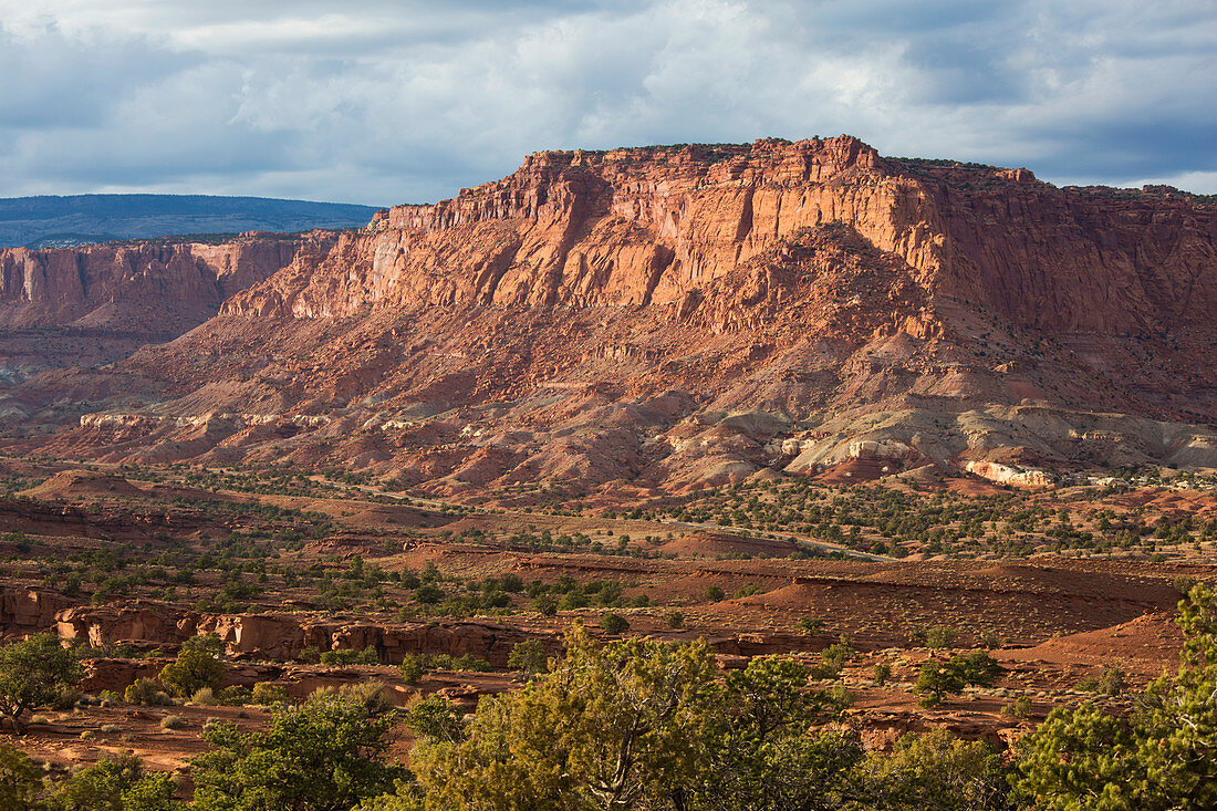View from Panorama Point across valley to rugged cliffs of the Waterpocket Fold, sunset, Capitol Reef National Park, Utah, United States of America, North America